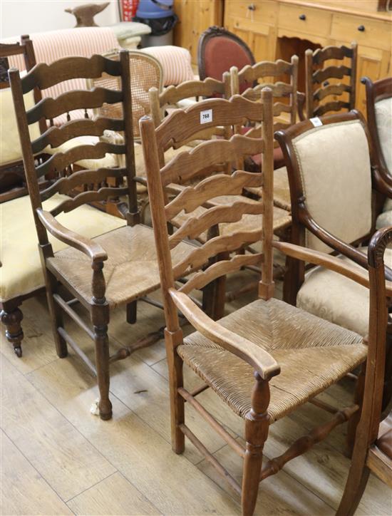 A set of five ash ladderback, rush seated dining chairs